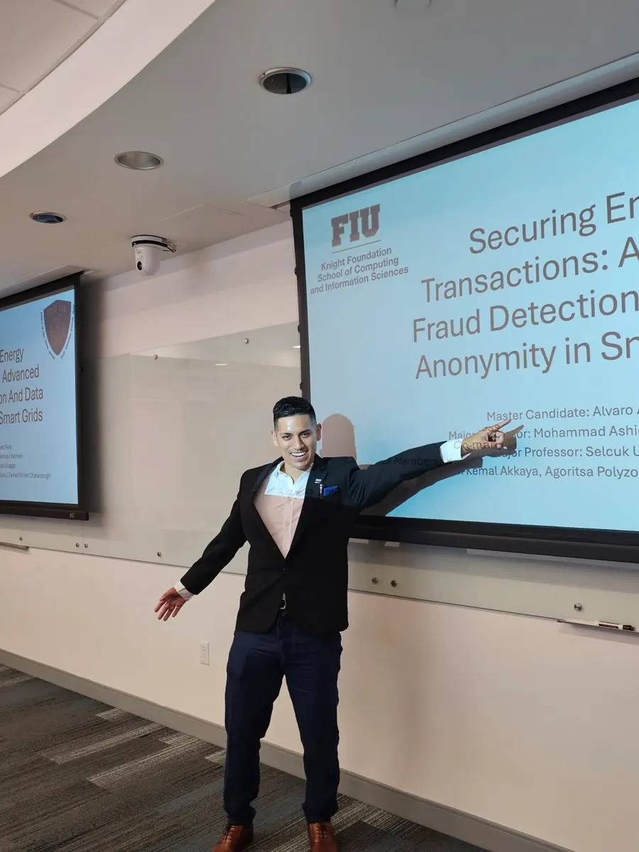 Alvaro presenting his thesis defense slides in a university lecture hall